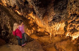 On a day off the slopes, kids are filled with awe on Adventure Park cave tours